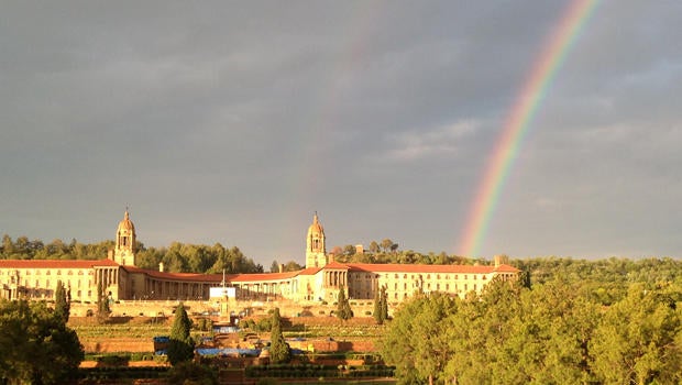 A rainbow is seen over the Union Buildings in Pretoria, South Africa, where former South African President Nelson Mandela's body lied in state for a second day Dec. 12, 2013.