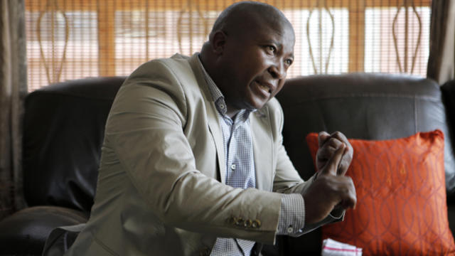 Thamsanqa Jantjie gestures at his home during an interview with The Associated Press in Johannesburg Dec. 12, 2013. 