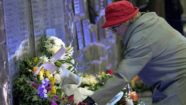 Families, relatives and dignitaries gather to pay their respects at the memorial service in Dryfesdale cemetery to commemorate the 25th anniversary of the bombing of Pan Am flight 103 in Lockerbie, Scotland, Dec. 21, 2013.