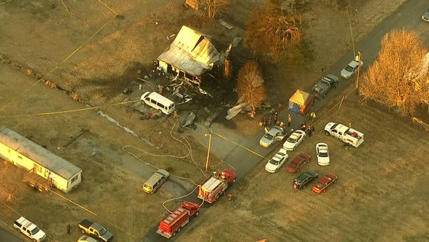 The scene of a deadly house fire is seen near Greenville, Ky., Jan. 30, 2014.