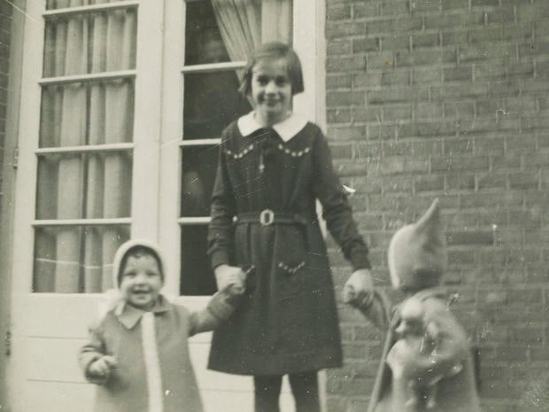 Toosje Kupers, centre, poses with two girls in Amsterdam