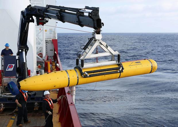 Crew aboard Australian Defence Vessel Ocean Shield moving U.S. Navy's Bluefin-21 autonomous underwater vehicle into position for deployment in southern Indian Ocean to look for missing Malaysia Airlines Flight 370 on April 14, 2014