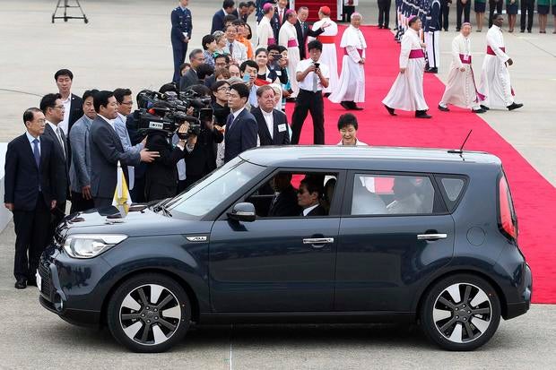 Pope Francis is seen in a Kia Soul car after his arrival at Seoul Air Base in Seongnam, South Korea