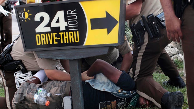 Tensions flare in Ferguson, Mo., over police shooting