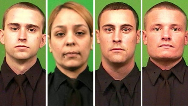 NYPD cops scale barbed wire fence to save woman in Bronx - CBS News