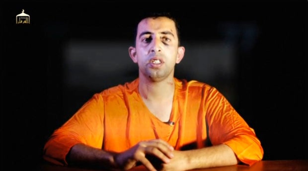 A man purported to be ISIS captive Jordanian pilot Muath al-Kasaesbeh speaks in still image from undated video filmed in undisclosed location made available on social media on February 3, 2015