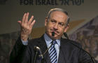 Israel's Prime Minister Benjamin Netanyahu gestures as he addresses the Jewish Agency Assembly in Tel Aviv, Israel 