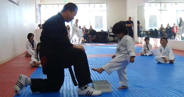 Watch Toddler adorably earns his Taekwondo white belt CBS News