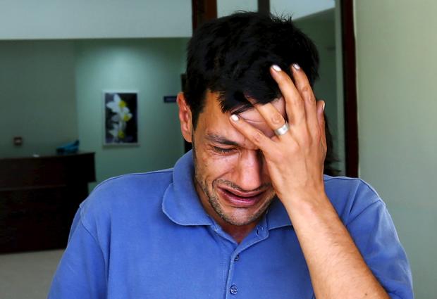 Abdullah Kurdi, father of three-year old Aylan Kurdi, cries as he leaves a morgue in Mugla, Turkey