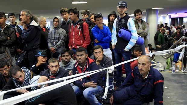 Migrants, who mostly crossed into Hungary from Serbia and are hoping to make their way to Austria, wait for trains heading to Hegyeshalom or Gyor in a transit area at Keleti station in Budapest, Hungary, Sept. 12, 2015.