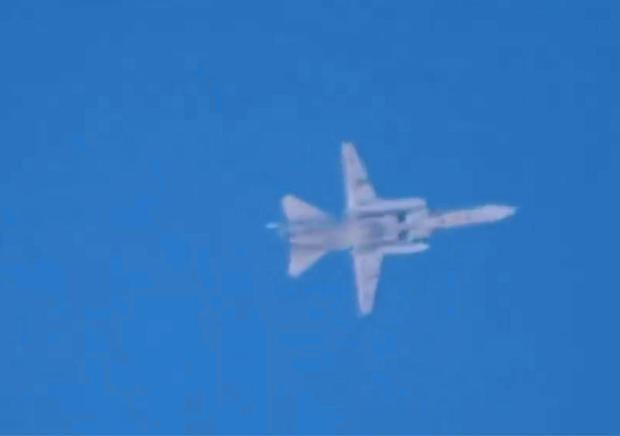 A fighter jet believed to be Russian is seen flying over Latamneh, in the northern Syrian governate of Hama, Sept. 30, 2015, in video posted online by anti-government activists. 