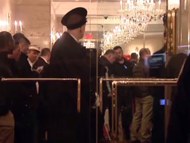 Investigators in crowded lobby of 100 Central Park South in Manhattan late on March 17, 2016 after what sources say was threatening letter was received by Donald Trump's son, Eric Trump