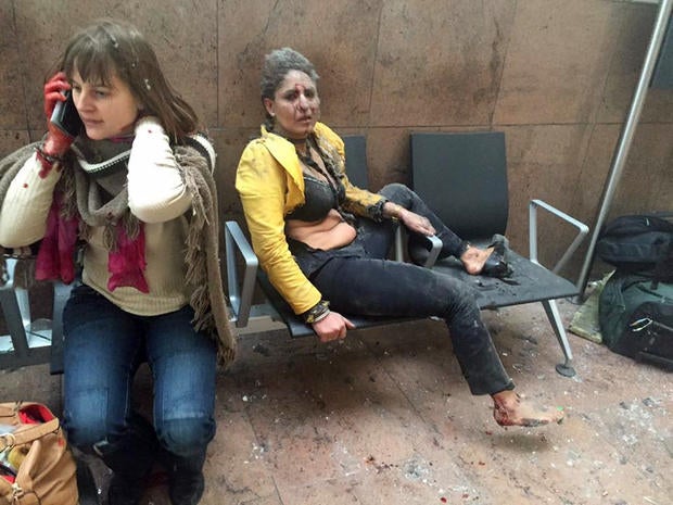 In this photo provided by Georgian Public Broadcaster and photographed by Ketevan Kardava, two women are seen wounded in Brussels' airport in Belgium after two explosions March 22, 2016.
