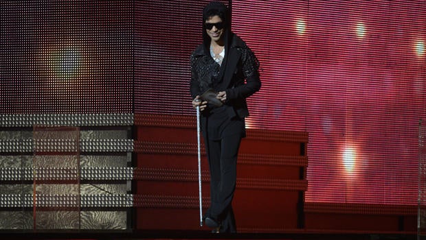 Musician Prince arrives to present the winner for Record of the Year on stage at the Staples Center during the 55th Grammy Awards in Los Angeles, California, Feb. 10, 2013.