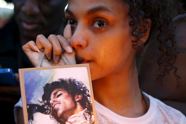 Julya Baer, 30, cries at a vigil to celebrate the life and music of deceased musician Prince in Los Angeles April 21, 2016.
