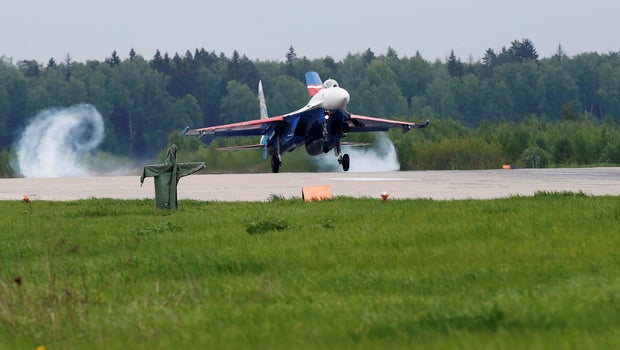 Russian fighter jet comes within feet of United States spy plane Russian fighter jet comes within feet of United States spy plane