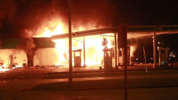 Gas station burns in Milwaukee during night of violent protests over a police shooting on August 13, 2016