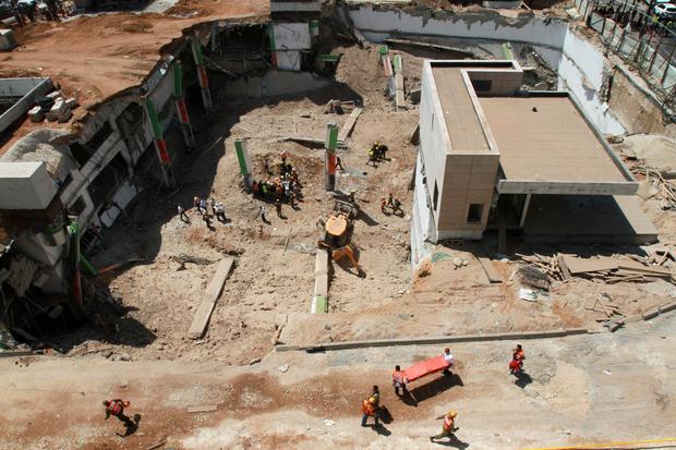 Israeli medics and emergency units work at a construction site where an underground car park collapsed