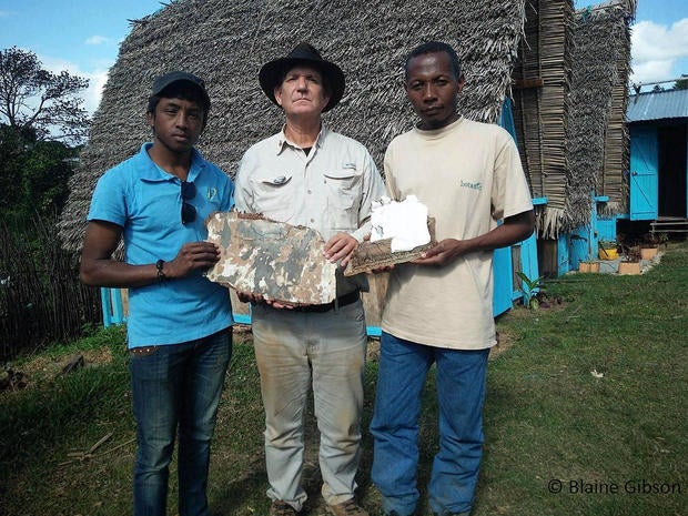 American wreckage hunter Blaine Gibson shows off pieces of suspected aircraft debris that he believes could be from missing Malaysia Airlines Flight 370