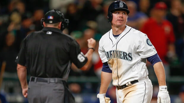 Steve Clevenger, No. 32 of the Seattle Mariners, heads back to the dugout after striking out with two runners on base to end the fifth inning against the Minnesota Twins at Safeco Field on May 28, 2016, in Seattle, Washington.