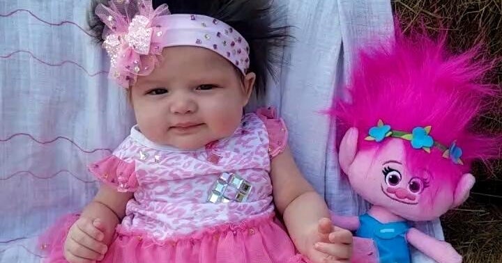 3monthold baby with head full of hair gets lots of
