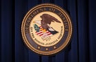 The Department of Justice logo is pictured on a wall after a news conference in New York Dec. 5, 2013. 