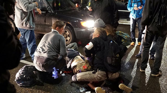 A demonstrator is treated for a gunshot wound during a protest against the election of Republican Donald Trump as president of the United States in Portland, Oregon, Nov. 12, 2016. 