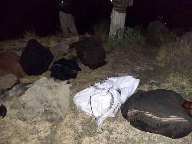 Villagers retrieved remains of passengers killed in a plane crash and placed them in shawls and covered bodies with cloth near Havelian, Pakistan, Dec. 7, 2016.