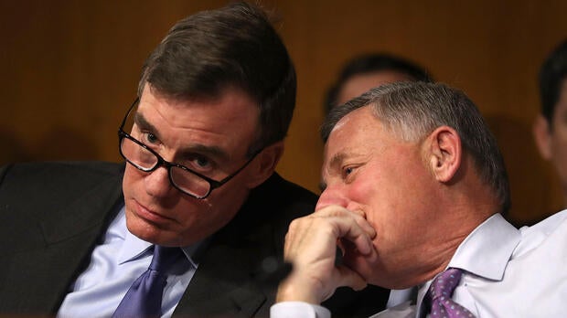 Sen. Mark Warner, left, D-Virginia, vice chair of the Senate Select Committee on Intelligence, and Sen. Richard Burr, R-North Carolina, the committee’s chairman, speak in the Dirksen Senate Office Building on Capitol Hill Jan. 10, 2017, in Washington.