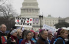 Demonstrators march past the U.S. Capitol during the Women’s March on Washington in Washington Jan. 21, 2017. 