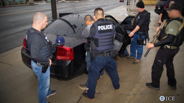 U.S. Immigration and Customs Enforcement (ICE) officers detain a suspect as they conduct a targeted enforcement operation in Los Angeles, California, on Feb. 7, 2017.