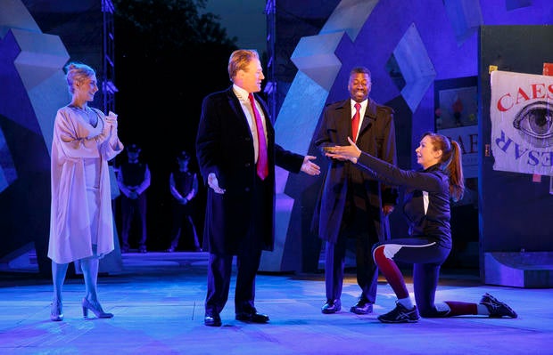 Tina Benko, left, portrays Melania Trump in the role of Caesar's wife, Calpurnia, and Gregg Henry, center left, portrays President Trump in the role of Julius Caesar during a dress rehearsal of The Public Theater's Free Shakespeare in the Park production
