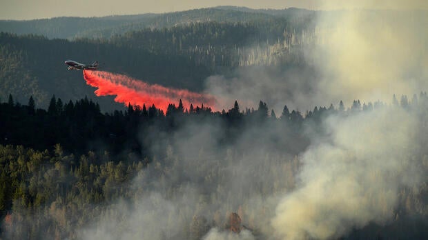 A 747 SuperTanker drops retardant while battling the Ponderosa Fire east of Oroville, California, Aug. 30, 2017.