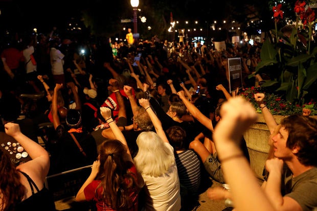 People react after the verdict in the murder trial of Jason Stockley a former St. Louis police officer in St. Louis
