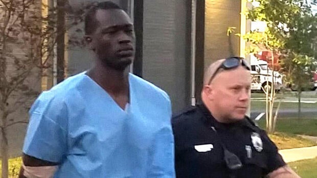 Emanuel Kidega Samson, 25, is taken to jail by police in Nashville, Tennessee, Sept. 24, 2017.
