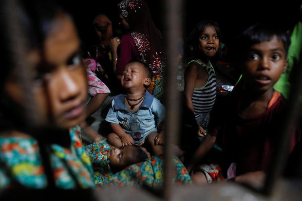 Rohingya refugee children who just arrived by wooden boats from Myanmar rest in a relief centre in a madrasa in Shah Porir Dwip