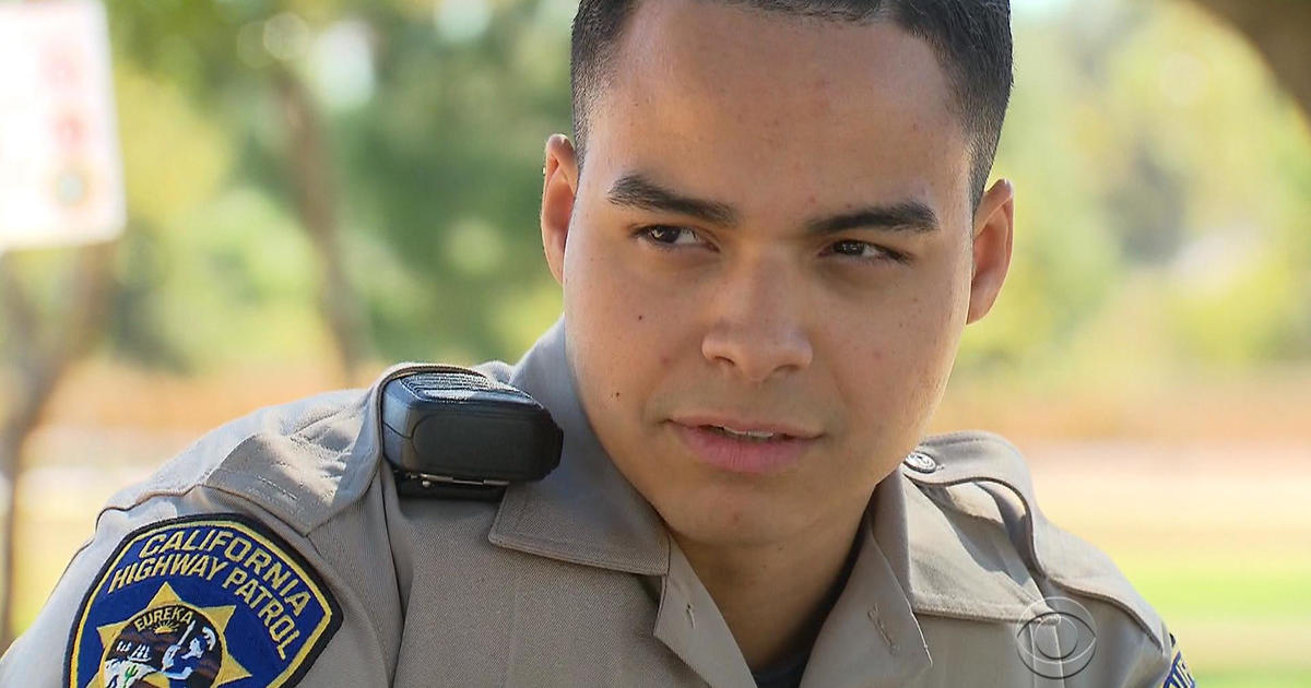 Once homeless, rookie cop has a lot to be thankful for - CBS News