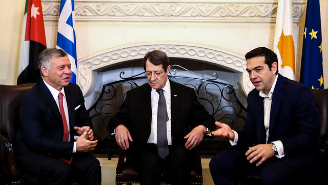 Cypriot President Nicos Anastasiades, Greek Prime Minister Alexis Tsipras and Jordan's King Abdullah talk during a meeting at the Presidential Palace in Nicosia 