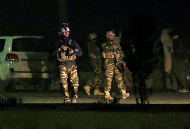 Afghan security force keep watch near the site of an attack on the Intercontinental Hotel in Kabul 
