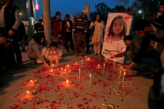 FILE PHOTO: Members of Civil Society light candles and earthen lamps to condemn the rape and murder of 7-year-old girl Zainab Ansari in Kasur, during a candlelight vigil in Islamabad