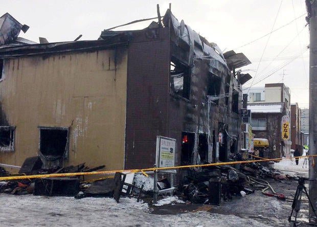The charred exterior of a senior persons welfare facility is pictured in Sapporo, Hokkaido