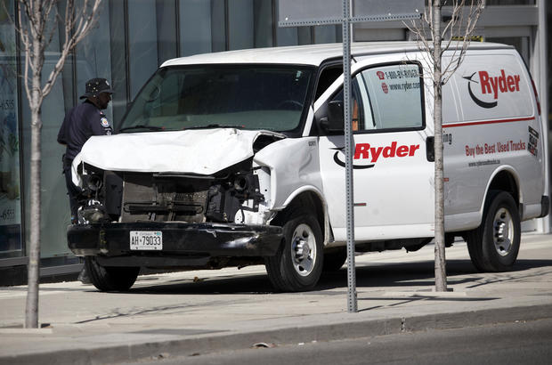Police inspect a van suspected of being involved in a collision at Yonge Street and Finch Avenue on April 23, 2018, in Toronto, Canada. 