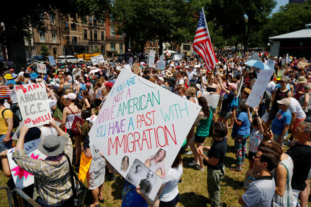 Demonstrators gather on the Boston Common during the "Families Belong Together" rally 