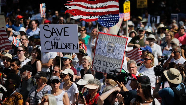 Signs from protests in cities across U.S. over immigration policy
