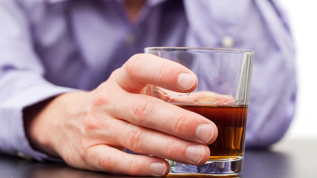 man drinking whisky