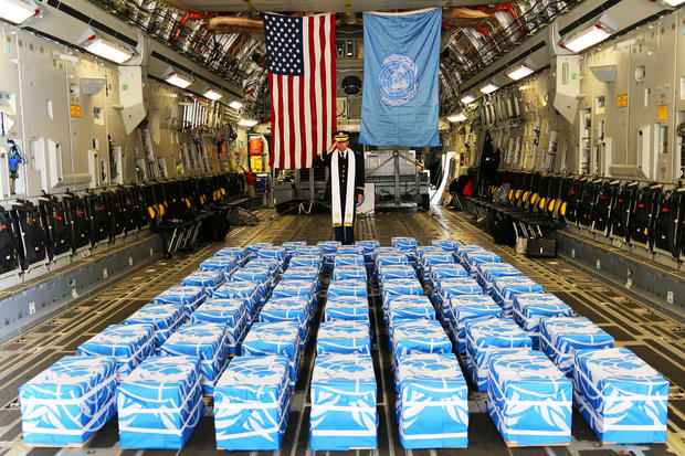 UN Command Chaplain U.S. Army Col. Lee performs a blessing on the 55 boxes of remains thought to be of U.S. soldiers killed in the 1950-53 Korean War at the Osan Air Base in South Korea 