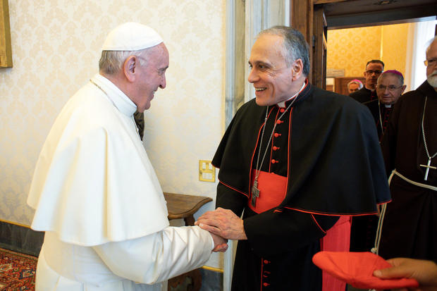 Pope Francis shakes hands with Cardinal Daniel DiNardo, Archbishop of Galveston-Houston, as he arrives with other U.S. Catholic Church leaders at the Vatican 