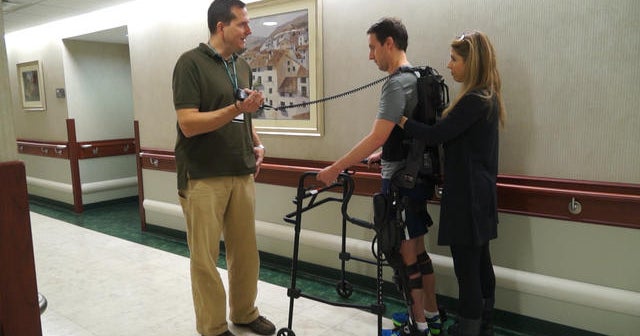 Exoskeleton robotics help a young stroke survivor get back on his feet