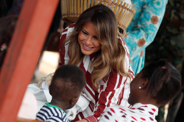 First American lady Melania Trump greets child during a visit to a hospital in Accra 