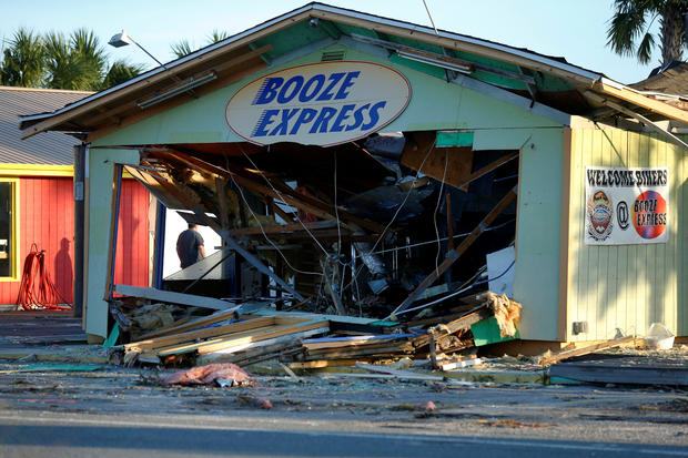 A man inspects a damaged building caused by Hurricane Michael in Panama City Beach 